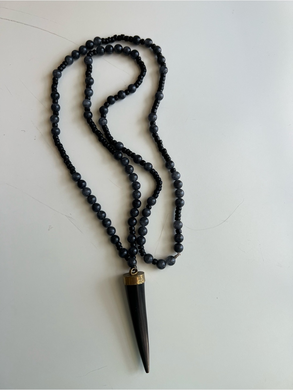 Black Beaded Necklace with Black Horn Pendant and Gold Accents